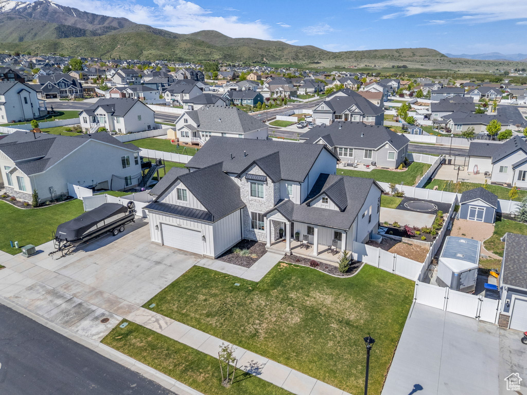 Aerial view of residential area with a mountainous background