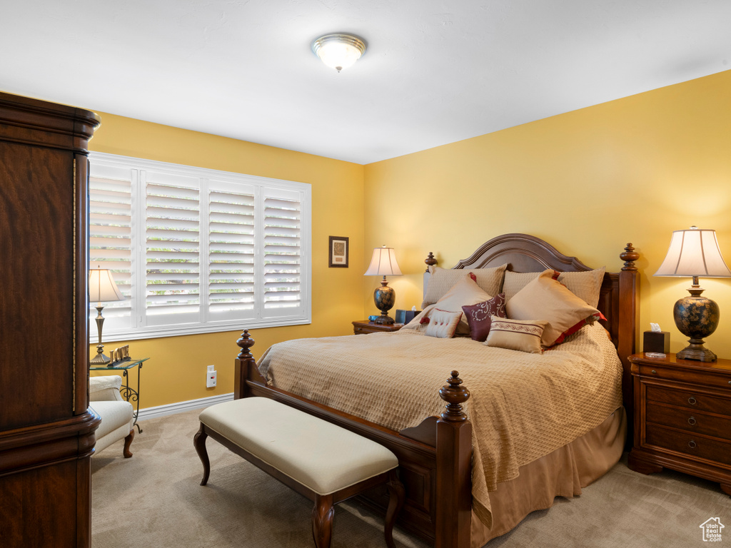 Carpeted bedroom with baseboards