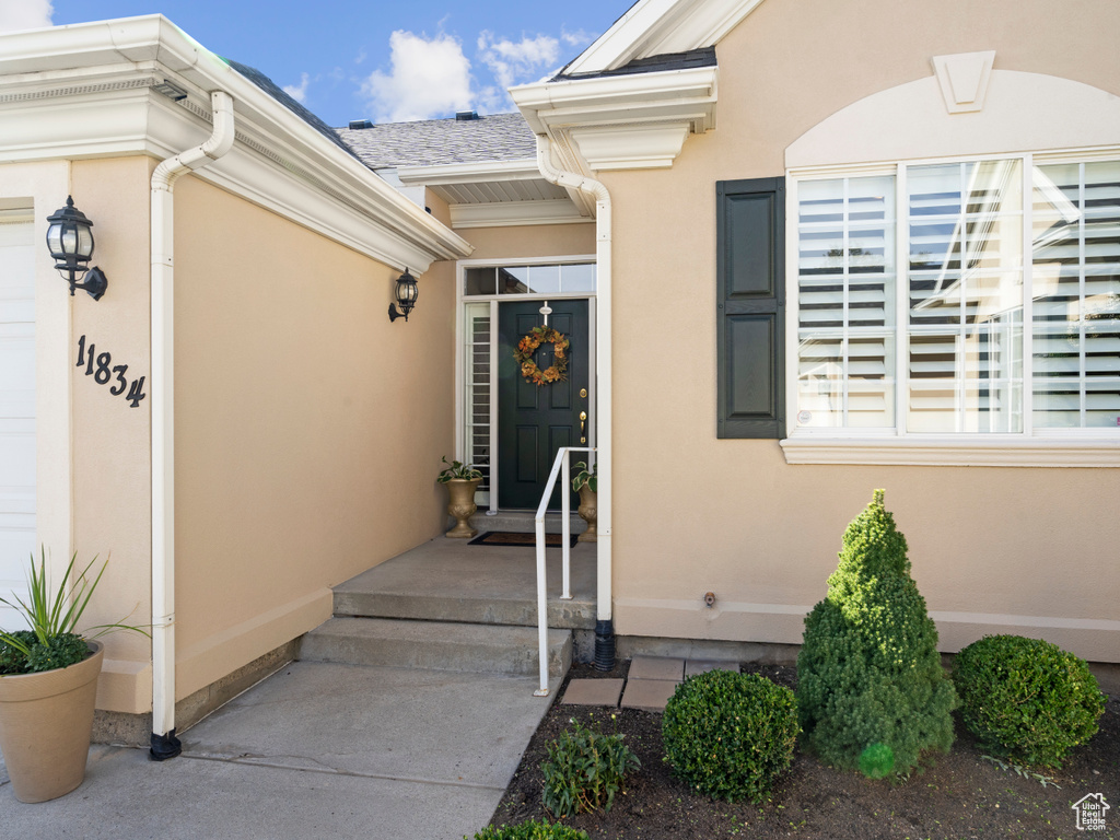 Property entrance with stucco siding