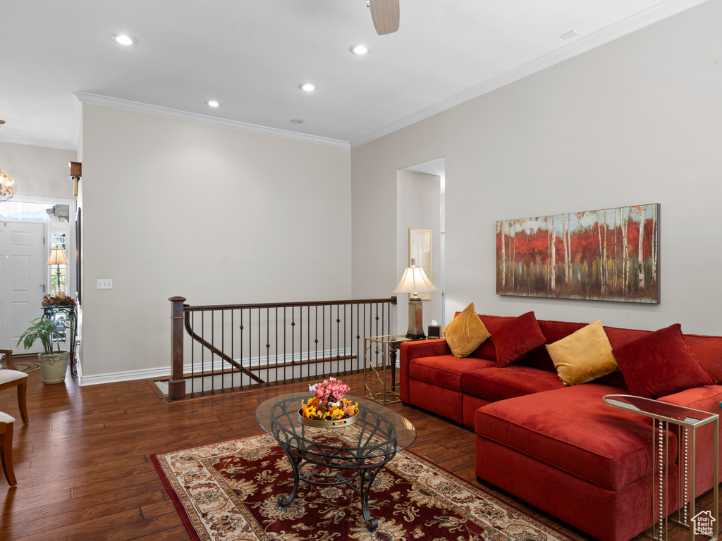 Living area with ornamental molding, hardwood / wood-style floors, recessed lighting, ceiling fan, and baseboards