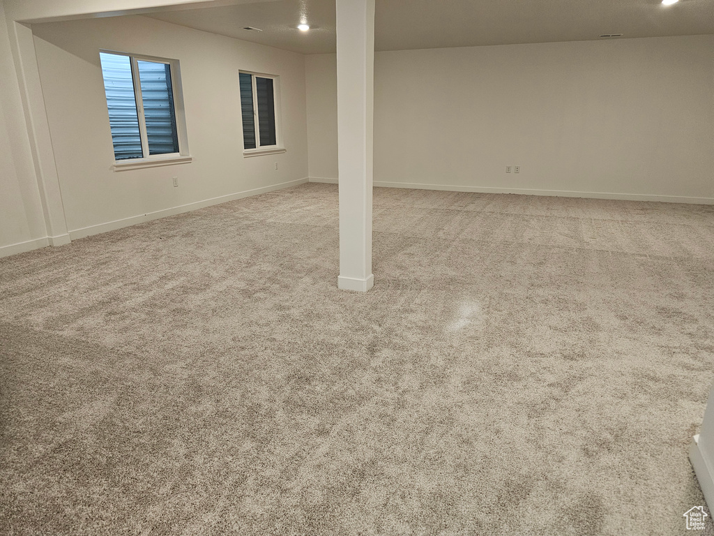 Below grade area with carpet floors and baseboards