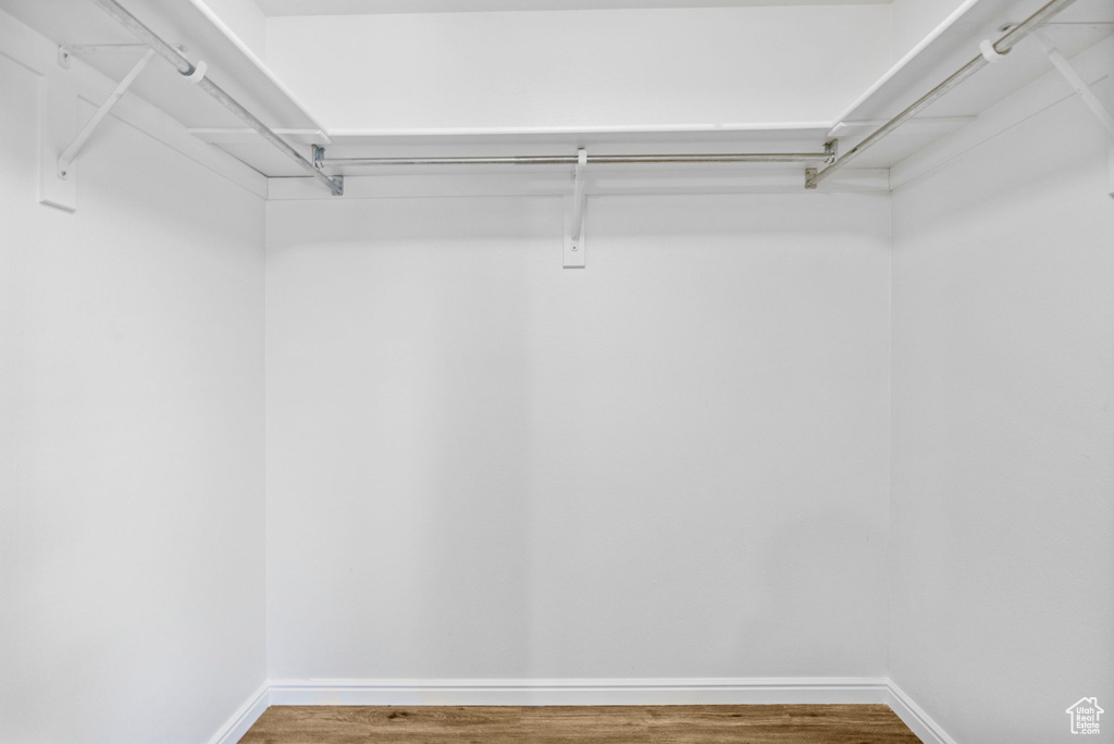 Spacious closet with wood finished floors