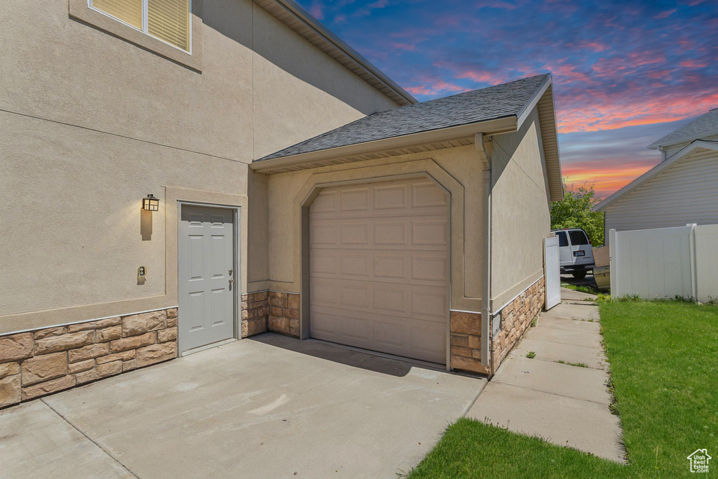 Garage with concrete driveway