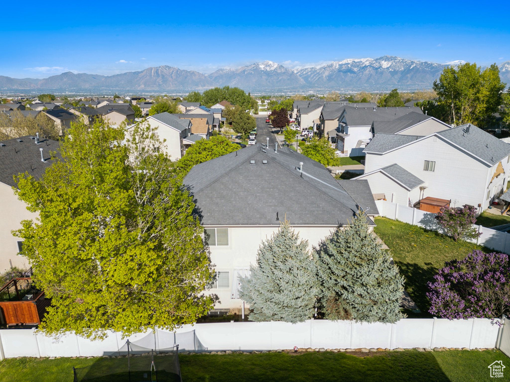 Aerial perspective of suburban area with a mountain backdrop