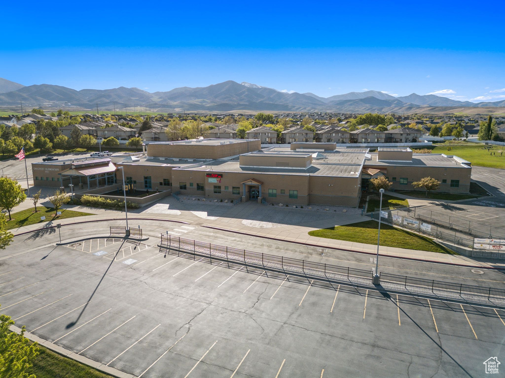 Aerial perspective of suburban area featuring a mountainous background