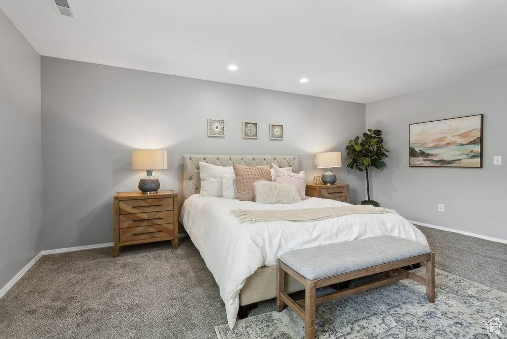 Bedroom with carpet floors, baseboards, and recessed lighting
