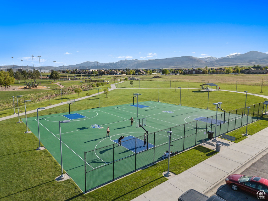 View of basketball court featuring a mountain view and community basketball court