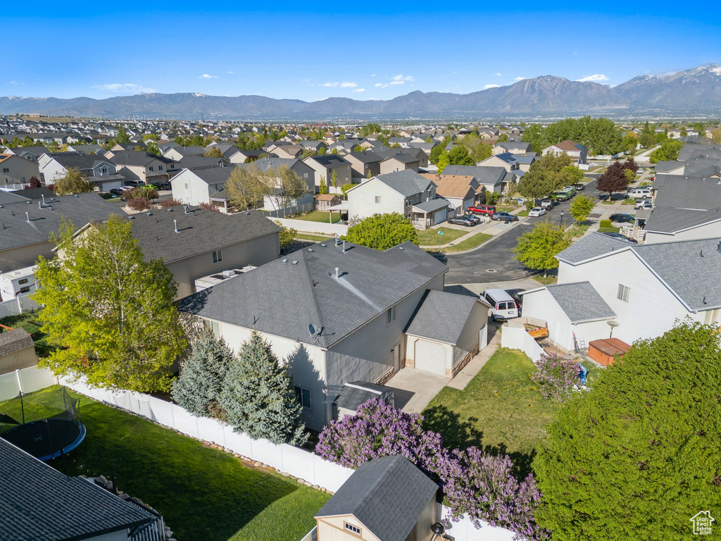 Aerial perspective of suburban area featuring a mountainous background