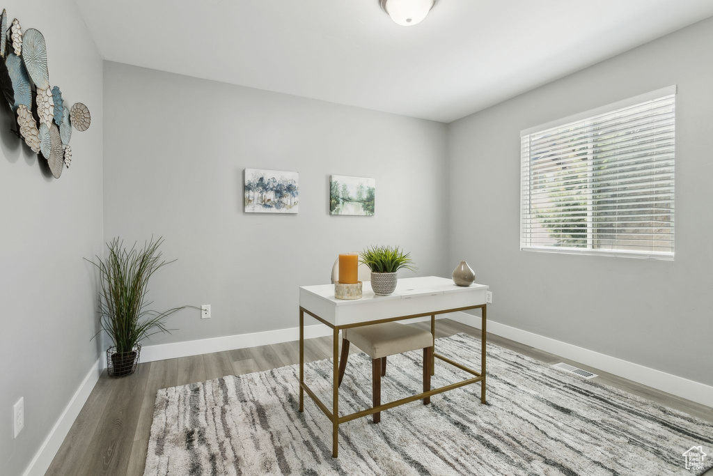Office featuring wood finished floors and baseboards