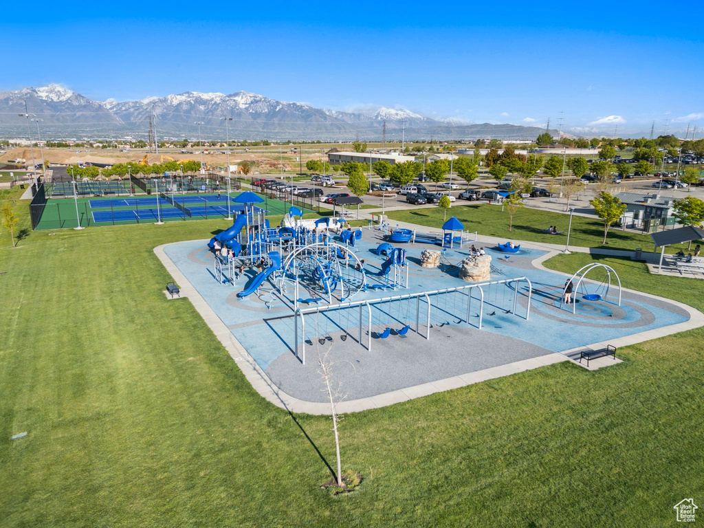 View of swimming pool featuring a mountain view and a yard