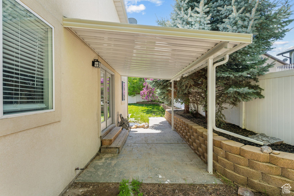 View of patio with fence