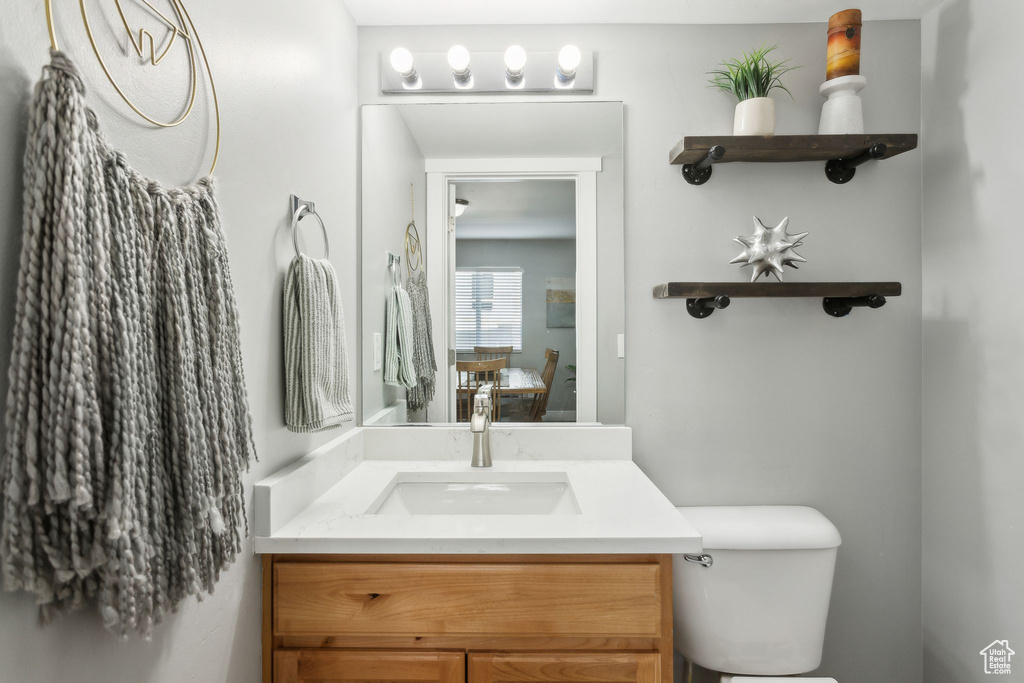 Bathroom with toilet and vanity