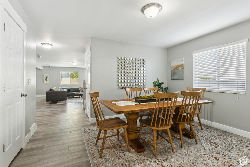 Dining area featuring baseboards and light wood-type flooring
