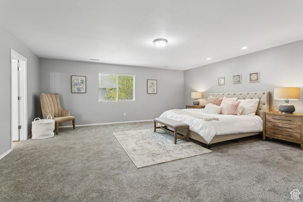 Carpeted bedroom featuring baseboards and recessed lighting