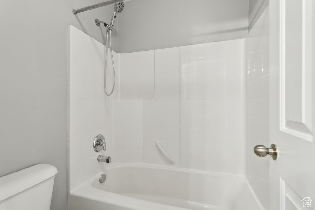 Full bath with toilet and tub / shower combination