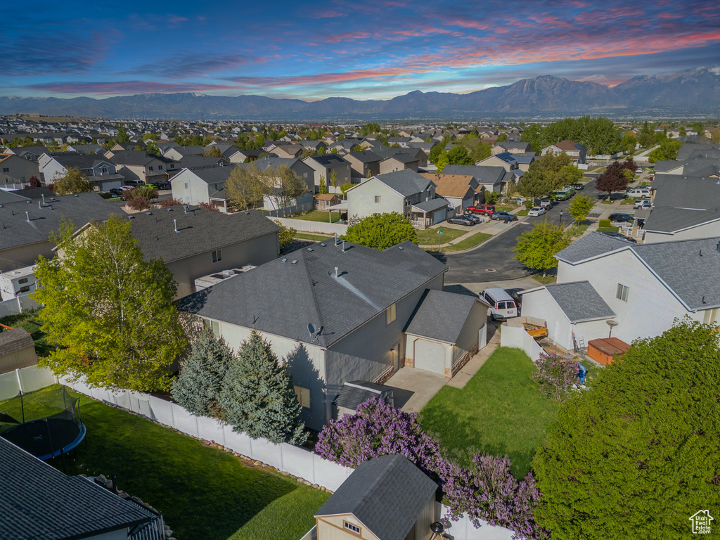 Aerial view of residential area featuring a mountain backdrop