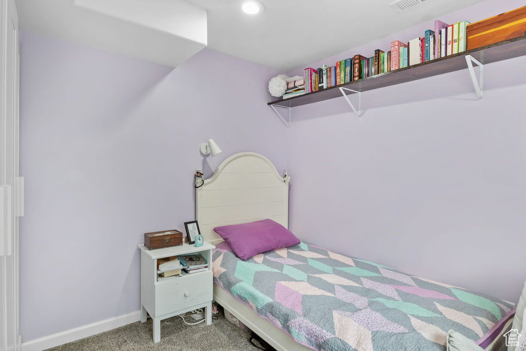 Bedroom with carpet floors, baseboards, and recessed lighting