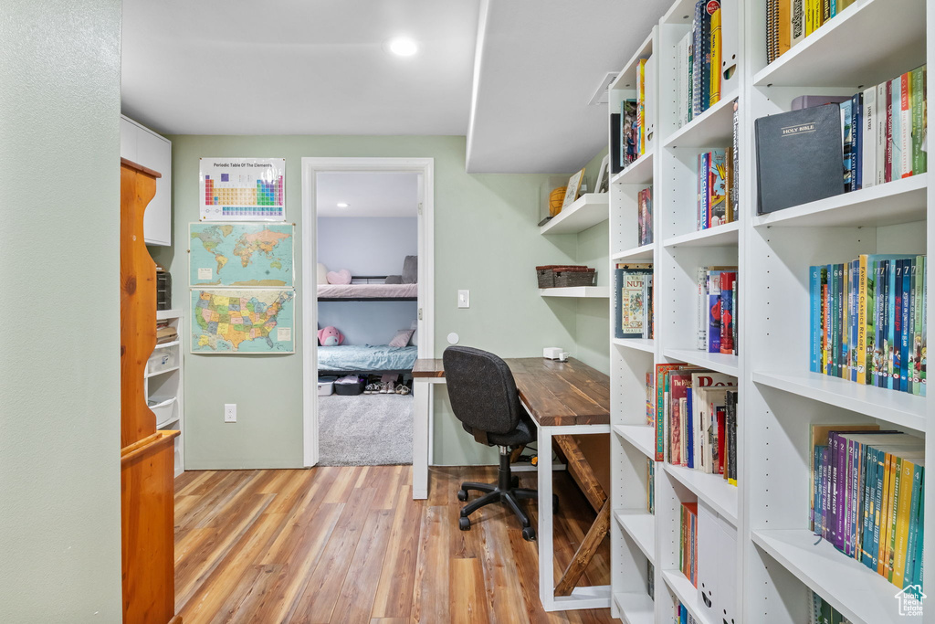 Home office featuring wood finished floors