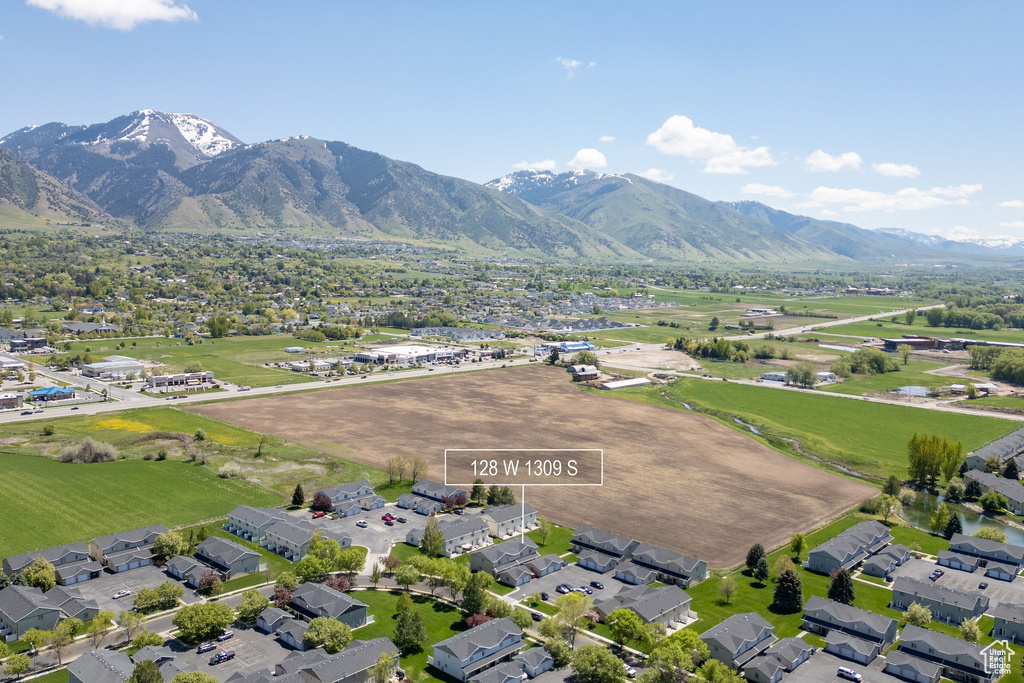 Aerial view of property\\\'s location with a mountain backdrop and nearby suburban area
