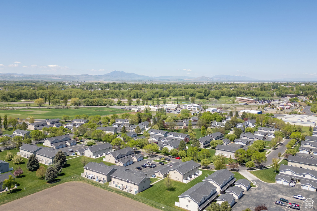 Aerial perspective of suburban area featuring a mountain backdrop