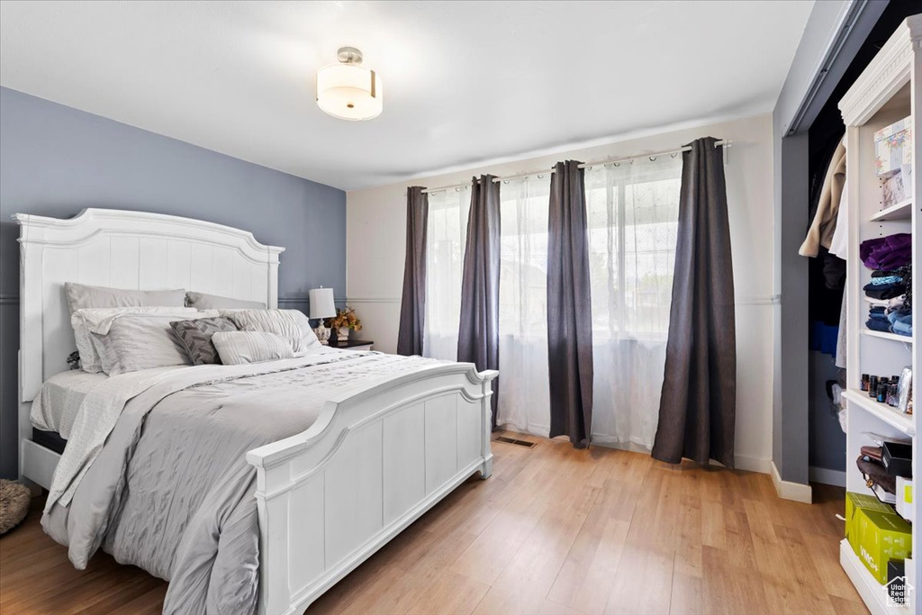 Bedroom with light wood-style flooring