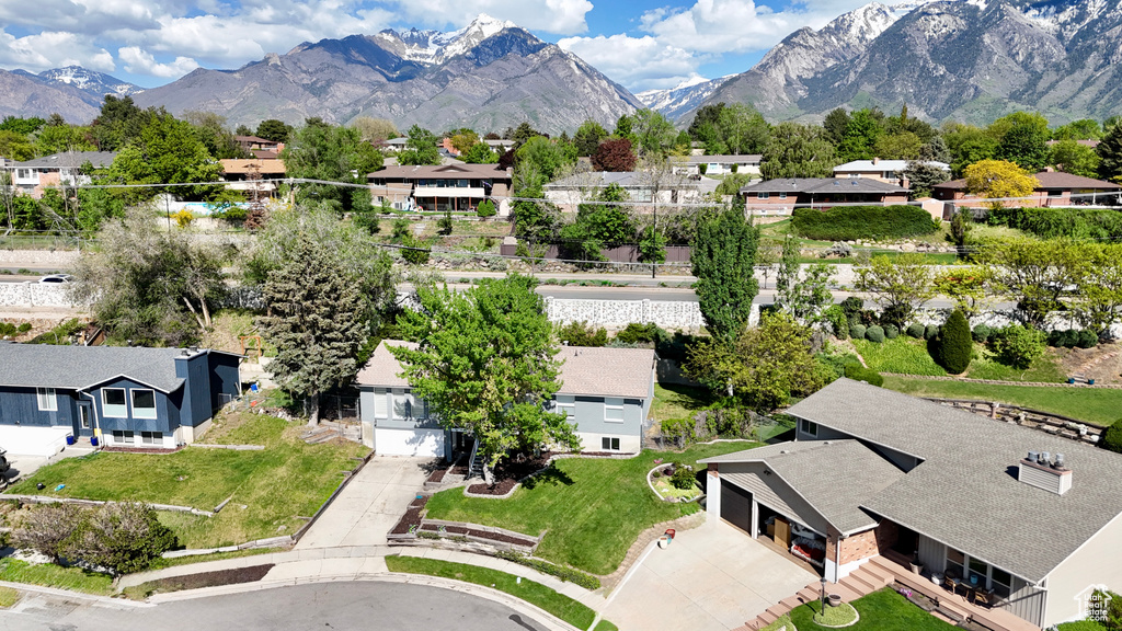 Aerial view of residential area featuring a mountain backdrop