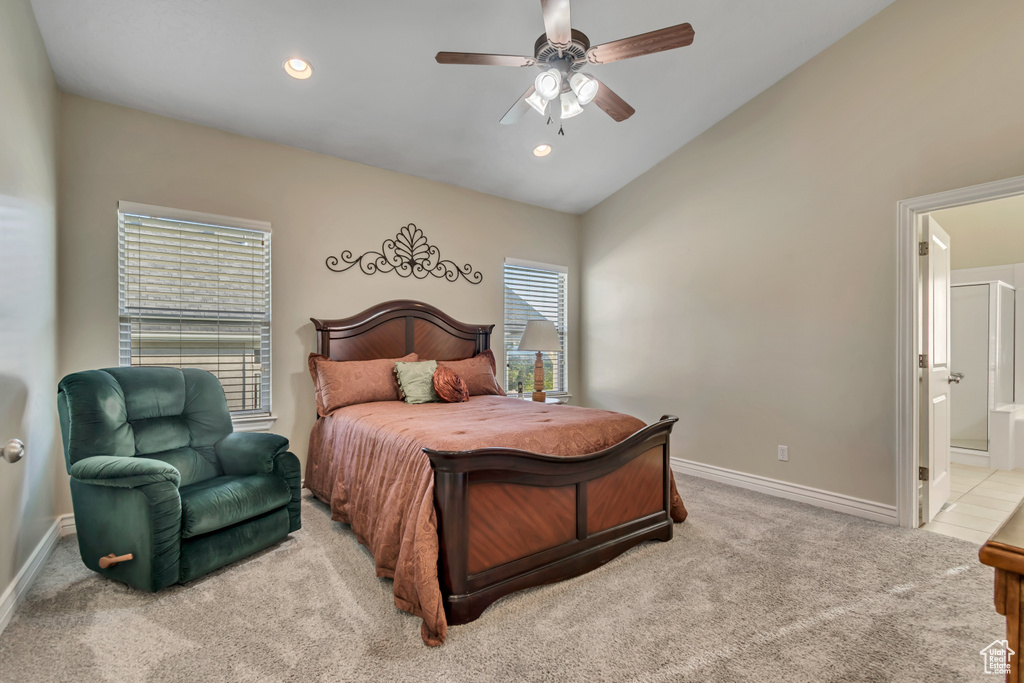 Bedroom with lofted ceiling, carpet flooring, ensuite bath, baseboards, and recessed lighting