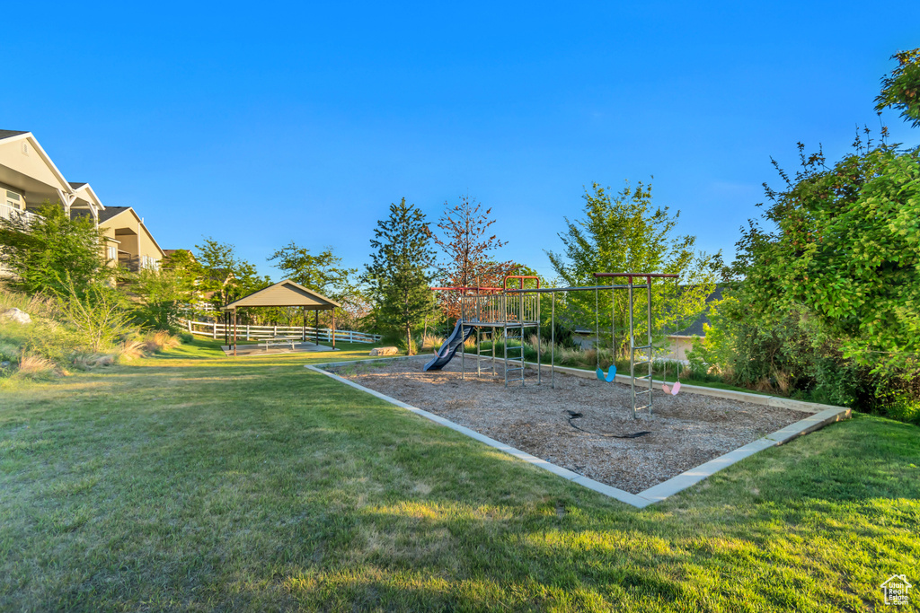 Community play area featuring a gazebo and a yard