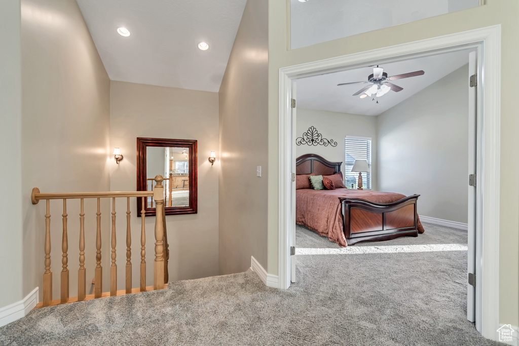 Bedroom featuring carpet flooring, baseboards, lofted ceiling, recessed lighting, and a ceiling fan
