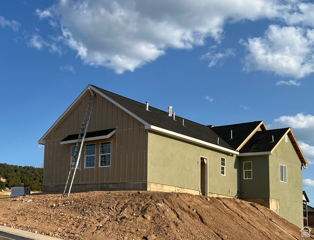 View of side of property with board and batten siding