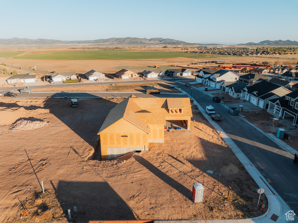 Aerial view of residential area with a mountain backdrop