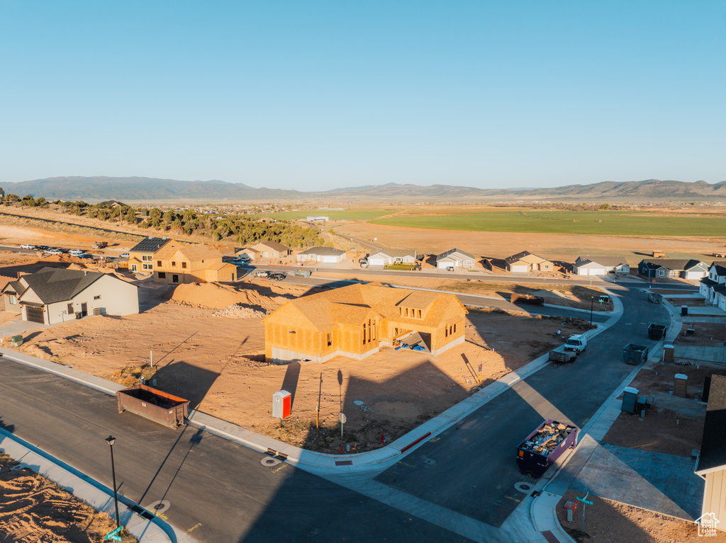 Aerial perspective of suburban area with a mountainous background