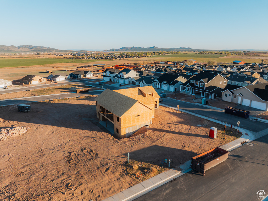 Aerial perspective of suburban area with a mountain backdrop