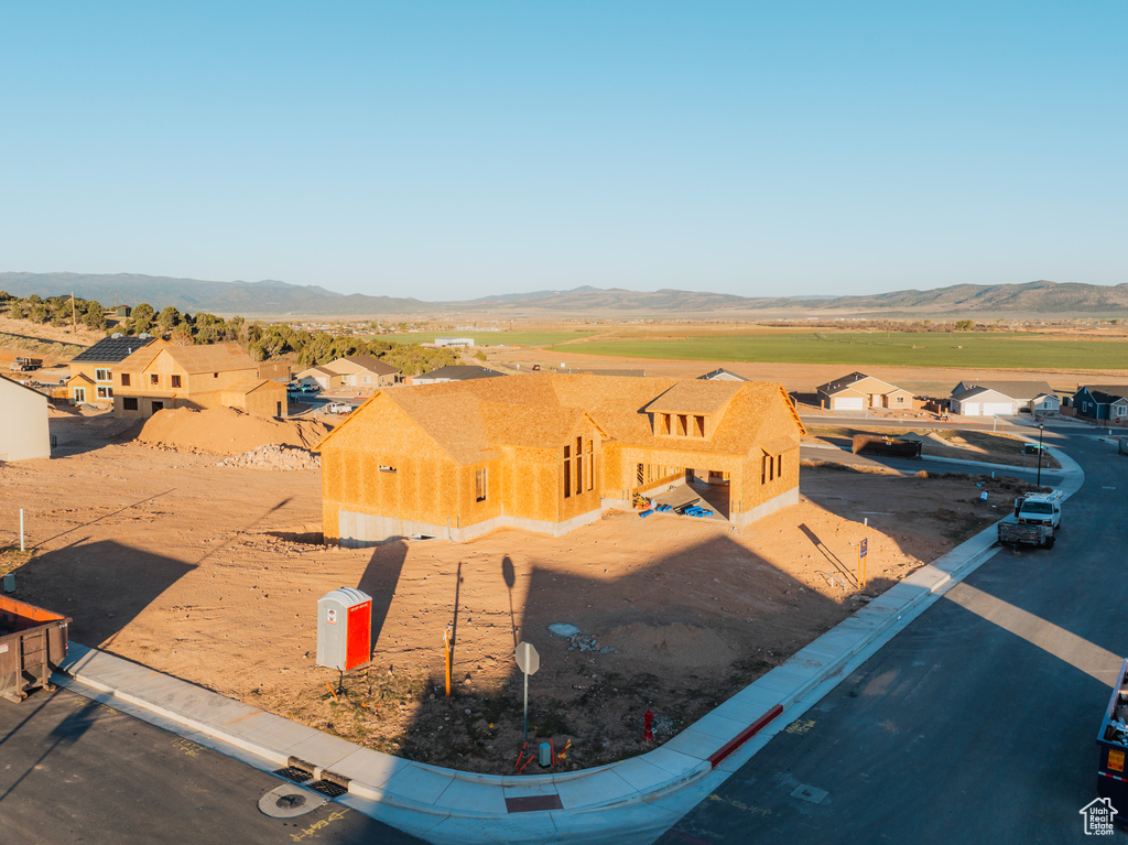 Aerial view of property and surrounding area with mountains
