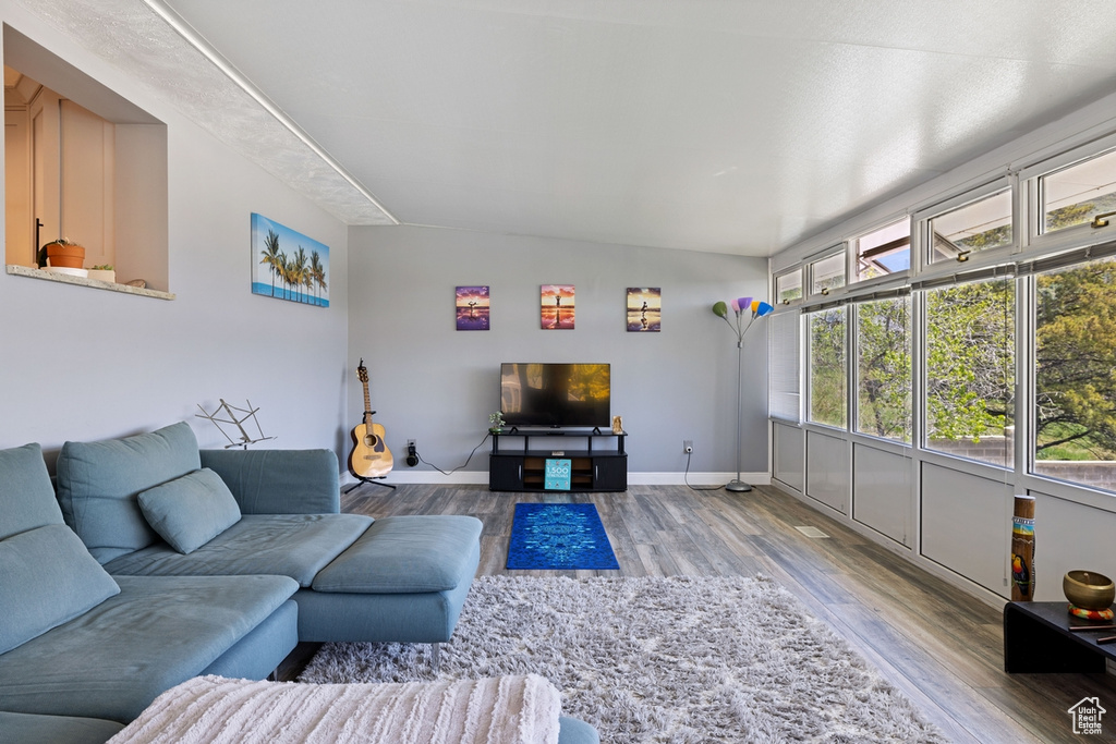 Living room with wood finished floors and baseboards
