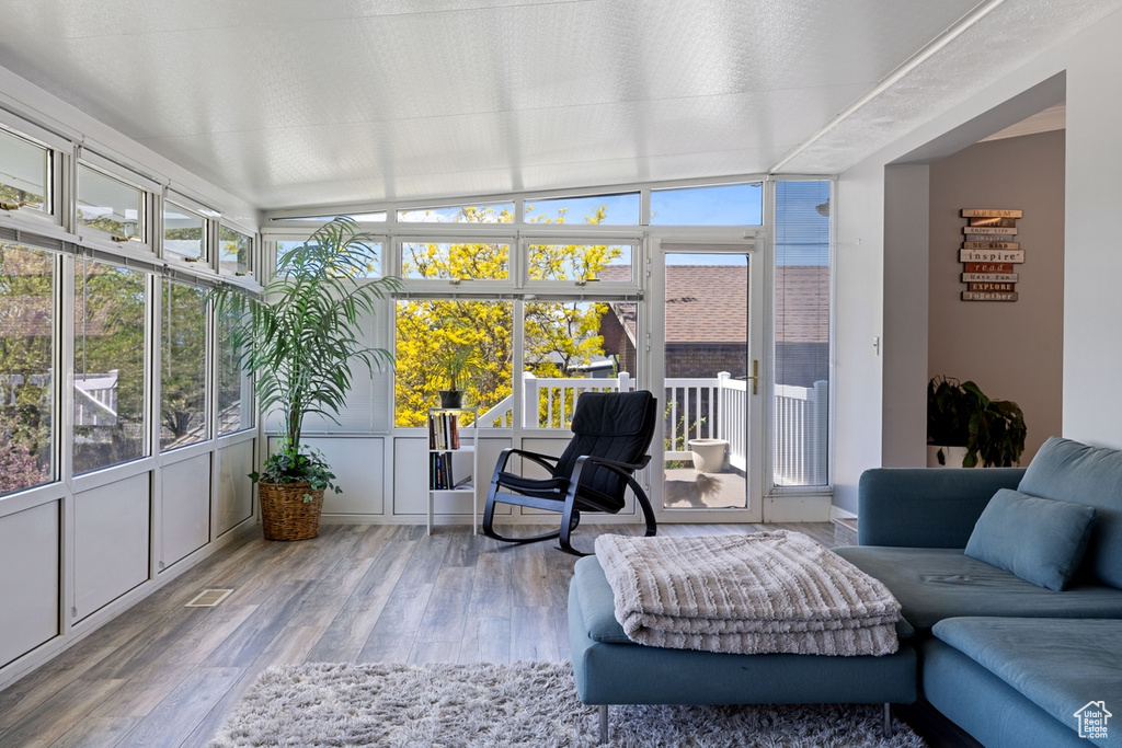 Sunroom with wood finished floors