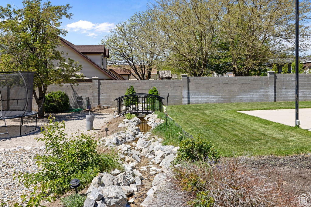 View of yard with a trampoline