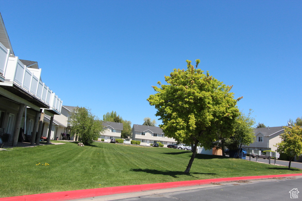 View of property\'s community with a residential view and a lawn