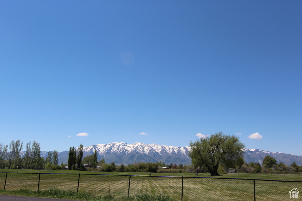 View of mountain backdrop featuring rural landscape