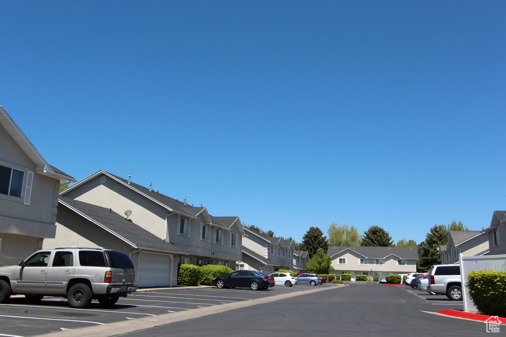 View of asphalt street featuring a residential view