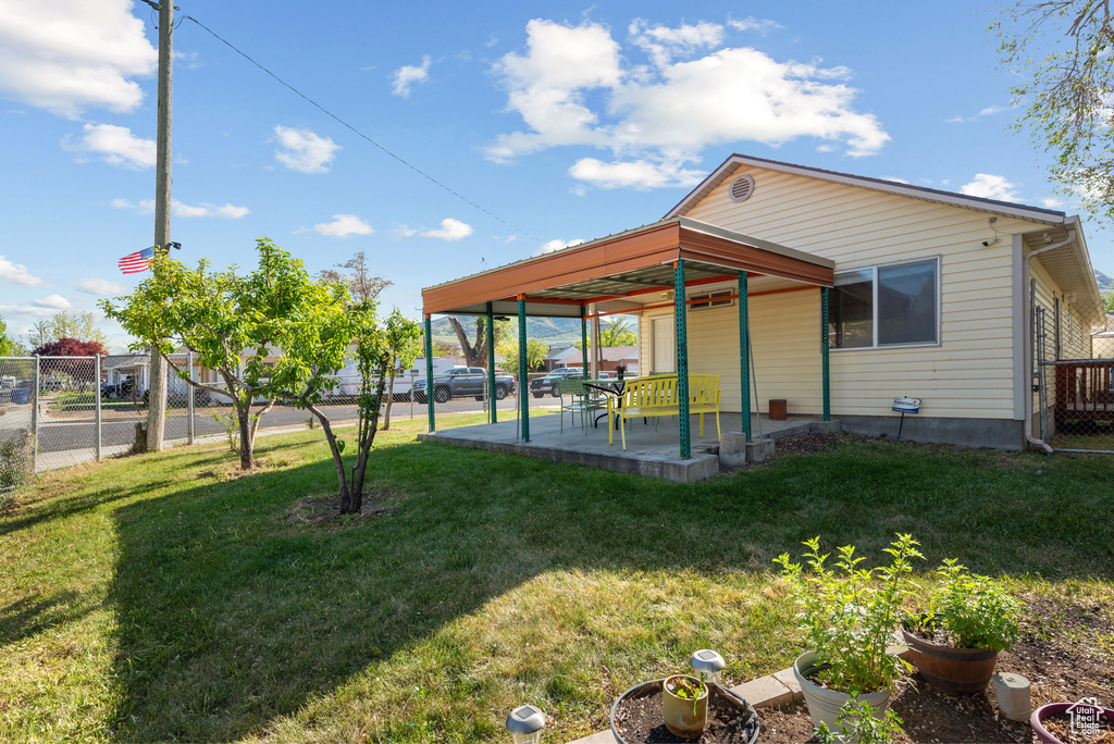 Back of property featuring a patio area