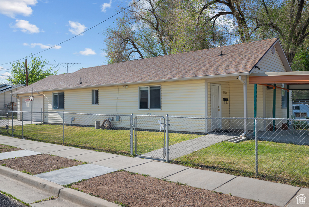 View of front of property with a gate and roof with shingles