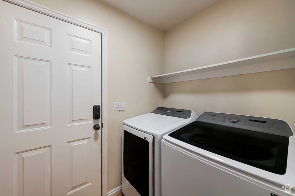 Washroom with separate washer and dryer and laundry area