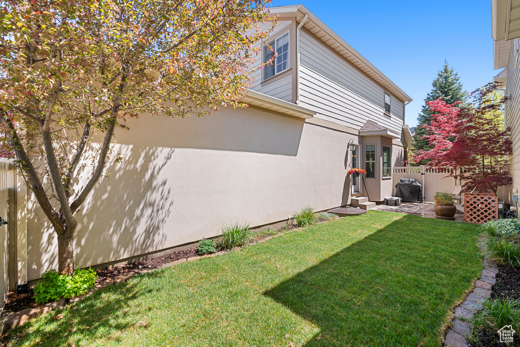 View of yard featuring fence