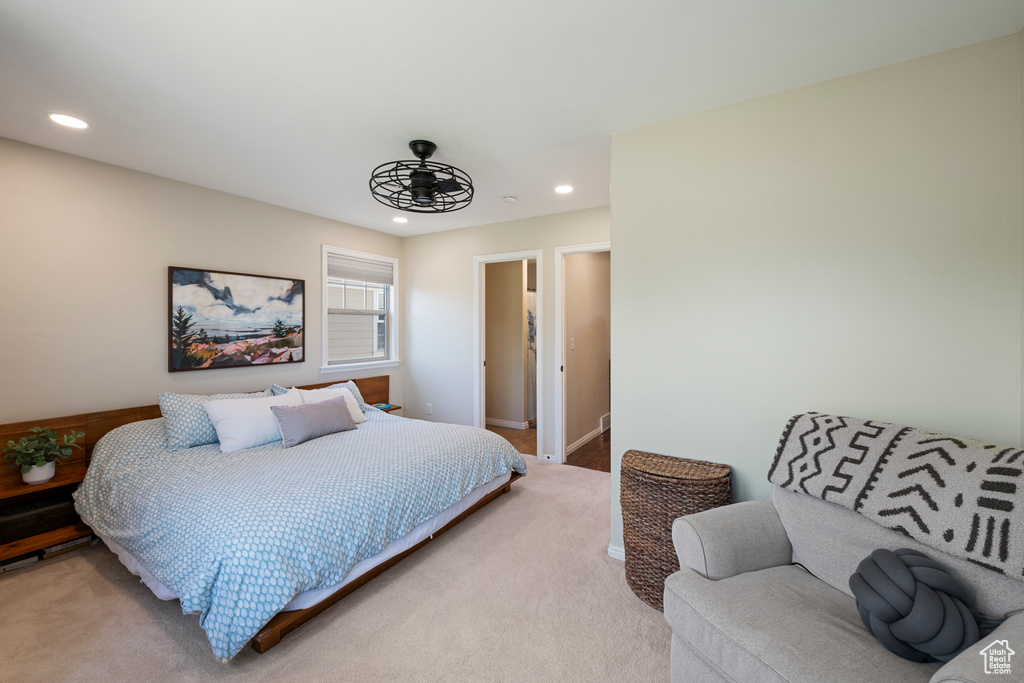 Bedroom with baseboards, recessed lighting, and light colored carpet