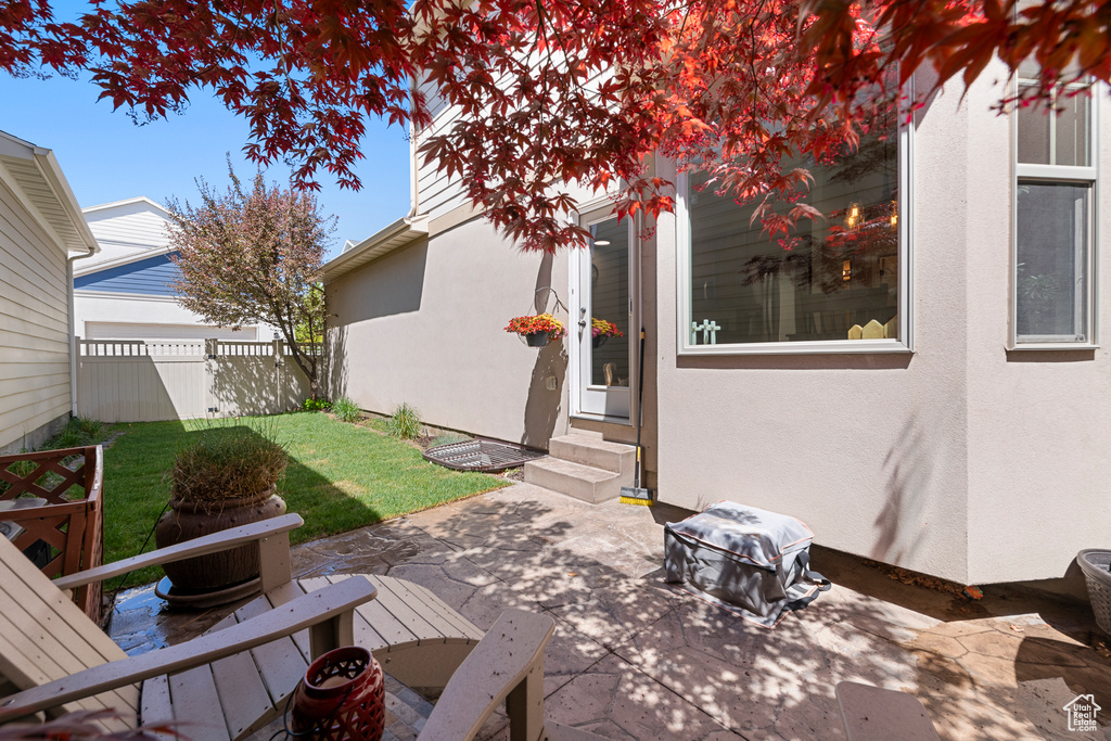 View of patio / terrace with entry steps and fence