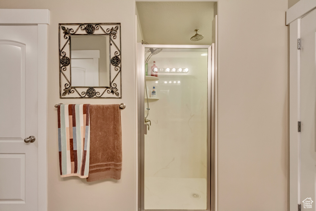 Full bathroom featuring a shower stall