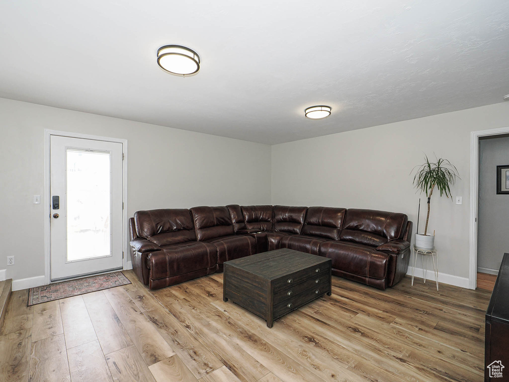 Living room with wood finished floors and baseboards