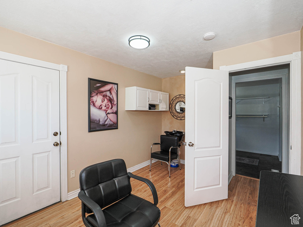 Office area featuring light wood-type flooring and baseboards
