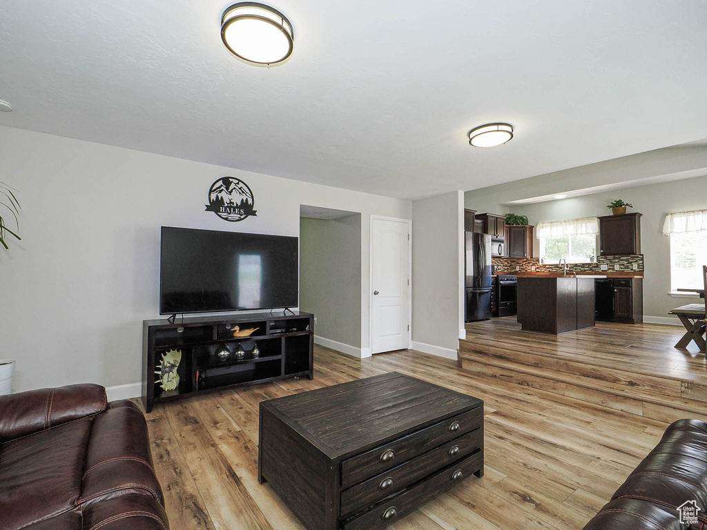 Living room with wood finished floors and baseboards